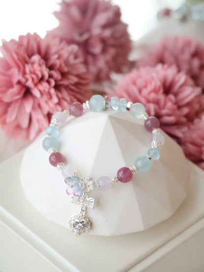 *Instocks*  -  Blossara - 8mm Blue Topaz, Aquamarine, Lilac Chalcedony & Lavender Rose Quartz with Dangly Sparkly Heart and Butterfly Rainbow Charm (Elastic)